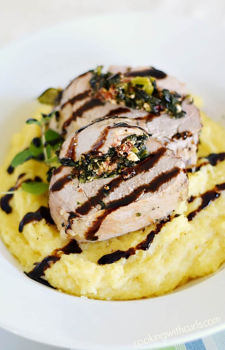Moist and tender Tuscan Stuffed Pork Loin served on a bed of creamy polenta and drizzled with balsamic glaze that is perfect for any special occasion cookingwithcurls.com #EntertainandPair #ad